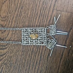 Long silver tone necklace with stone